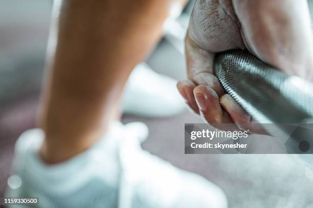 close up of unrecognizable person exercising with barbell. - sports chalk stock pictures, royalty-free photos & images