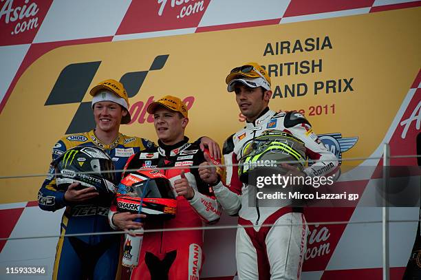 Bradley Smith of Great Britain and Tech 3 Racing, Stefan Bradl of Germany and Viessmann Kiefer Racing and Michele Pirro of Italy and Gresini Racing...