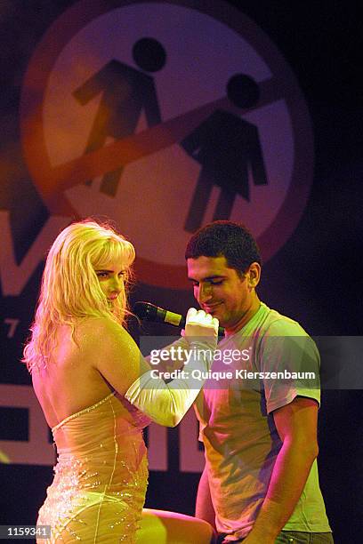 Former porn star and former member of the Italian parliament Chicholina performs with an Israeli spectator at the Love City Sexy Festival July...