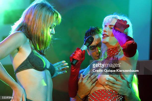 Spectator touches former porn star and former member of the Italian parliament Chicholina as she performs at the Love City Sexy Festival July 24,2002...