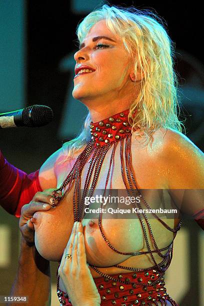 Spectator touches former porn star and former member of the Italian parliament Chicholina as she performs at the Love City Sexy Festival July 24,2002...