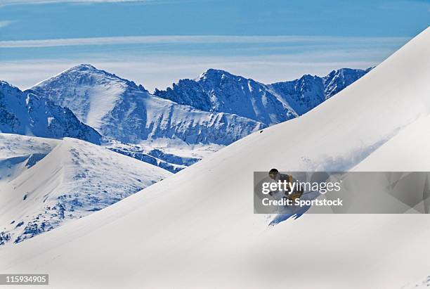 snow skier making first tracks with mountain view - colorado skiing stock pictures, royalty-free photos & images