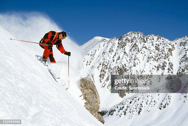 snow skier on steep grade with mountain view - steep stock pictures, royalty-free photos & images