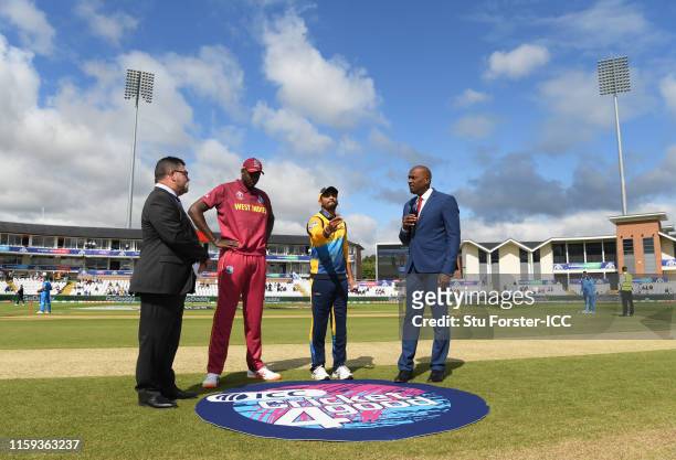 General view of the toss as Dimuth Karunaratne of Sri Lanka flips the coin during the Group Stage match of the ICC Cricket World Cup 2019 between Sri...