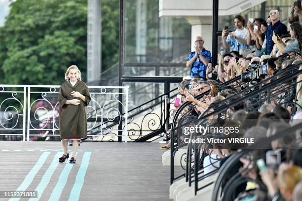 Fashion designer Miuccia Prada walks the runway during the MIU MIU resort Jockey Club Spring/Summer 2020 fashion show at the Hippodrome d'Auteuil on...