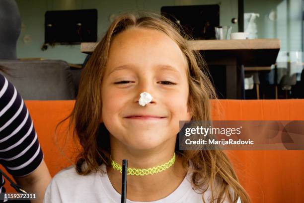 dirty girl with whipped cream in a cafe - white dinner jacket stock pictures, royalty-free photos & images