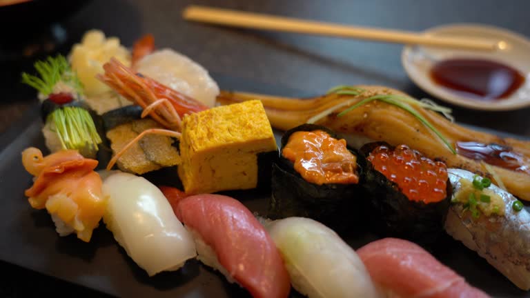 https://media.gettyimages.com/id/1159376548/video/sushi.jpg?b=1&s=640x640&k=20&c=TdHTddrjv7ZWHdobXWhMAh3yKVJCtb61XEwBB7egONw=