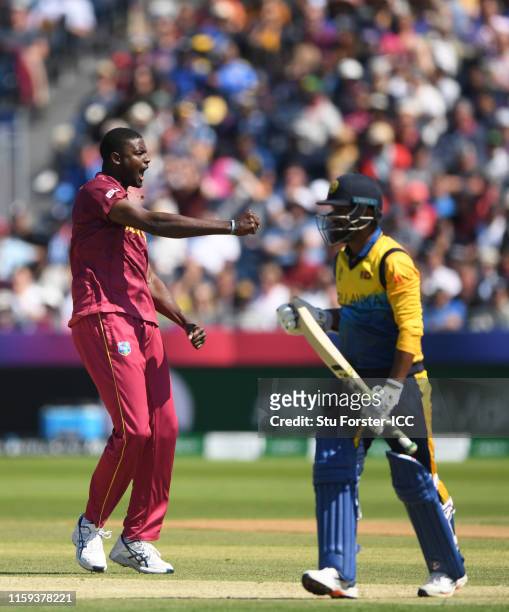 Jason Holder of West Indies celebrates after taking the wicket of Dimuth Karunaratne of Sri Lanka during the Group Stage match of the ICC Cricket...
