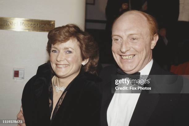 British politician Neil Kinnock, Leader of the Labour Party, with his wife Glenys at the BAFTA awards in London, 16th March 1986.