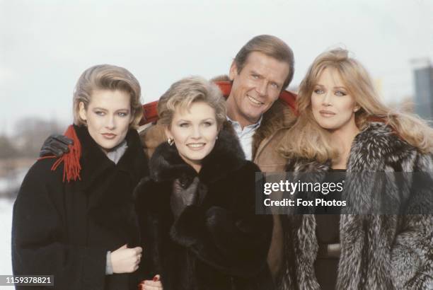 From left to right, actors Alison Doody, Fiona Fullerton, Roger Moore and Tanya Roberts pose at Pinewood Studios in England, to promote the new James...