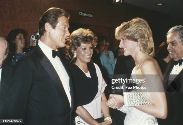 English actor Roger Moore and his wife Luisa meet Diana, Princess of Wales at the premiere of the James Bond film 'Octopussy' at the Odeon Leicester...