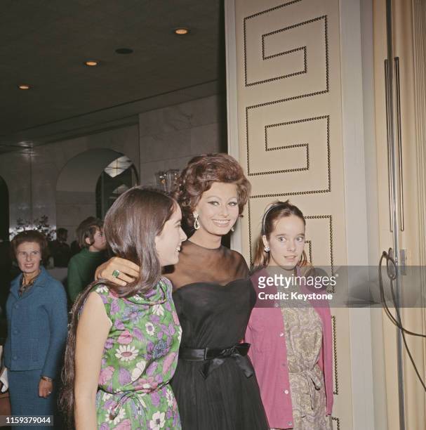 Italian actress Sophia Loren with Charlie Chaplin's daughters Victoria and Josephine at the Savoy Hotel in London, England, for a press conference on...
