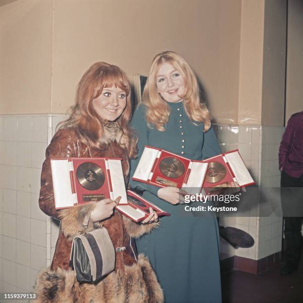 Scottish singer Lulu and Welsh singer Mary Hopkin holding their awards at the Disc And Music Echo Valentine's Day Award Ball in London, 15th February...
