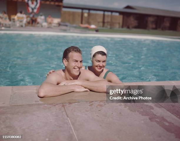 American actress and swimmer Esther Williams in a swimming pool with her husband, actor Ben Gage , circa 1950.