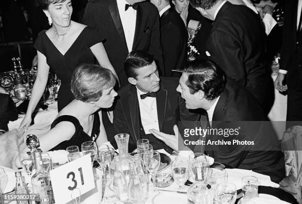 From left to right, actors Julie Andrews, Roddy McDowall and Marcello Mastroianni at the 22nd Golden Globe Awards, USA, 8th February 1965.