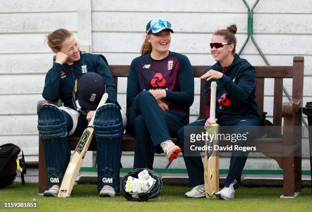 Anya Shrubsole, Sophie Ecclestone and Linsey Smith look on during the England nets practice at Fischer County Ground on July 01, 2019 in Leicester,...