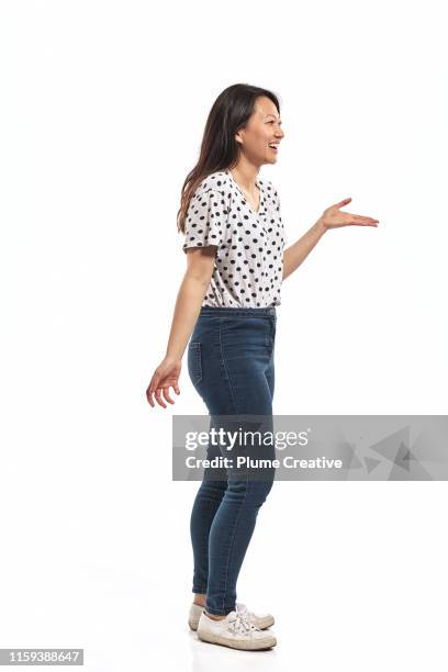 portrait of a young woman in studio - female jeans stock pictures, royalty-free photos & images