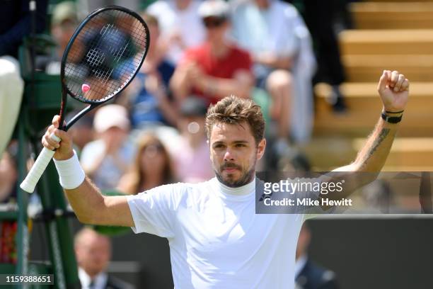 Stan Wawrinka of Switzerland celebrates match point in his Men's Singles first round match against Ruben Bemelmans of Belgium during Day one of The...