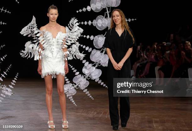 Dutch designer Iris van Herpen acknowledges the audience at the end of the Iris Van Herpen Haute Couture Fall/Winter 2019 2020 show as part of Paris...