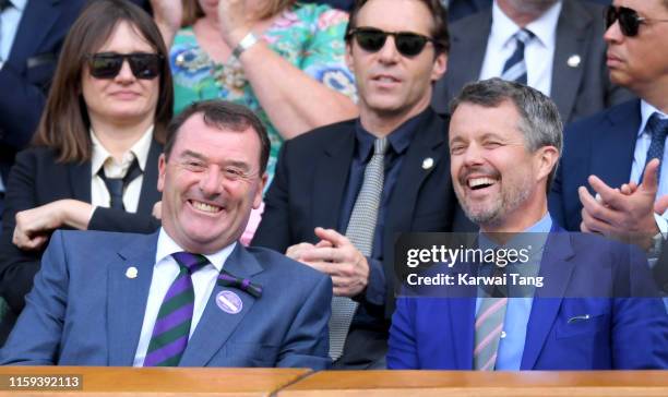 Wimbledon Chairman Philip Brook and Crown Prince Frederik of Denmark attend day 1 of the Wimbledon Tennis Championships at the All England Lawn...