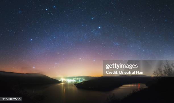 milky way panorama at eifel national park in germany - photopollution stock-fotos und bilder