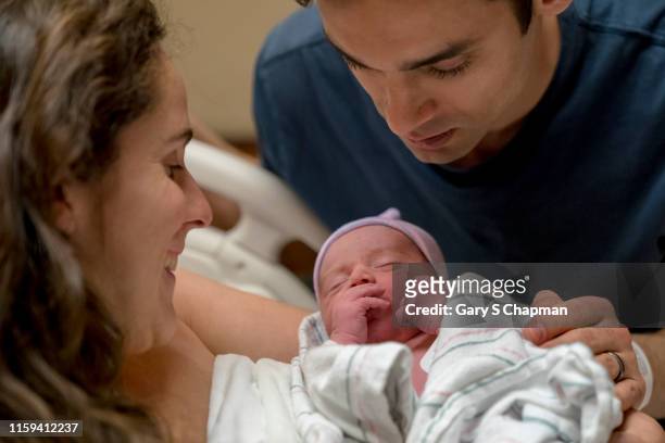 latino mom and dad with newborn boy in hospital - s dear mama event stock pictures, royalty-free photos & images