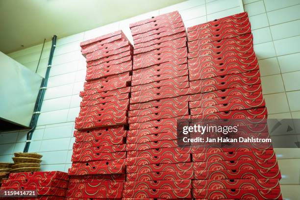 pile of pizza boxes - pizzeria stock pictures, royalty-free photos & images