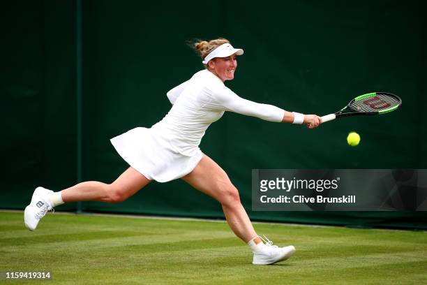 Madison Brengle of The United States plays a backhand in her Ladies' Singles first round match against Marketa Vondrousova of The Czech Republic...