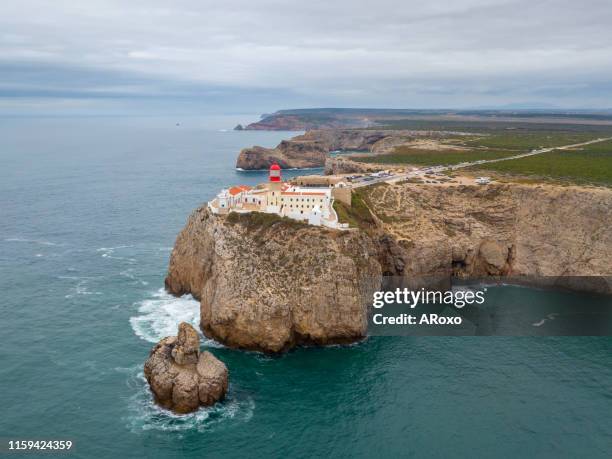 aerial drone panoramic view of the lighthouse and cliffs at cape st. vincent at sunset. algarve seascape.  amazing landscape.continental europe's most south-western point, sagres, portugal. - sagres imagens e fotografias de stock