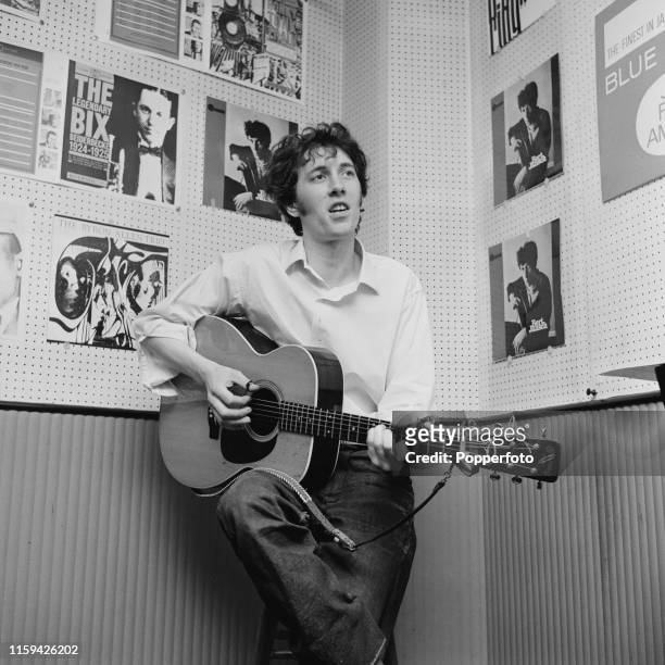Scottish folk musician, singer and guitarist Bert Jansch pictured playing an acoustic guitar in London in June 1965.