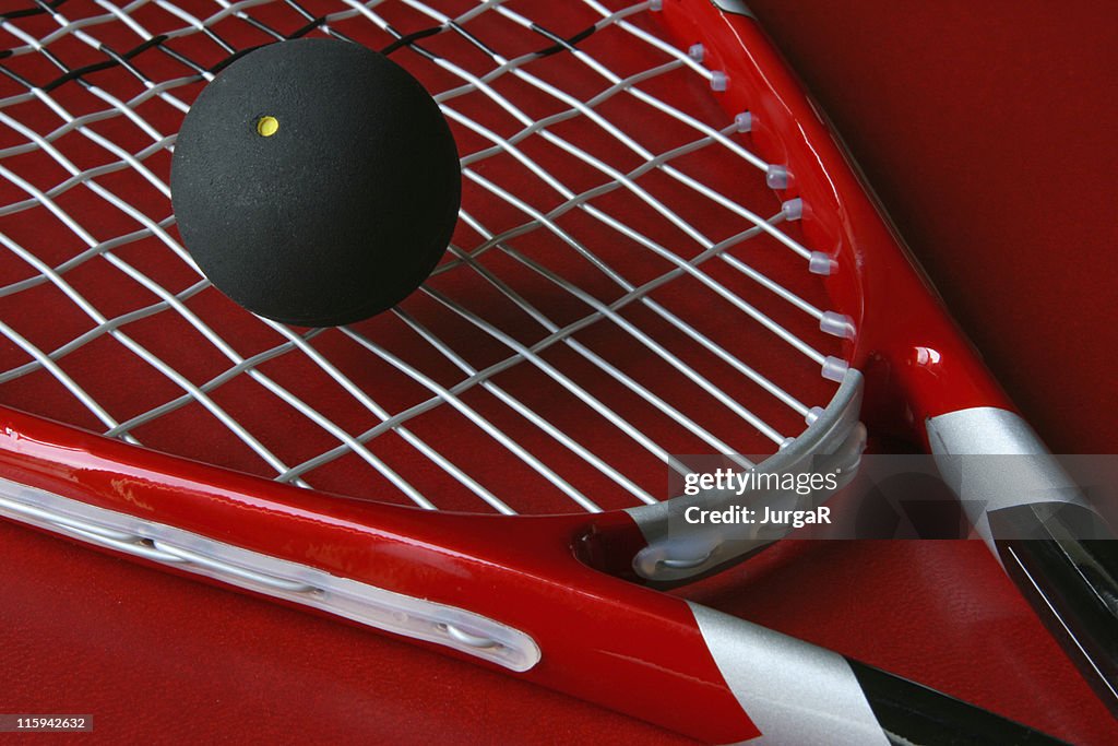 Close up squash racket and ball