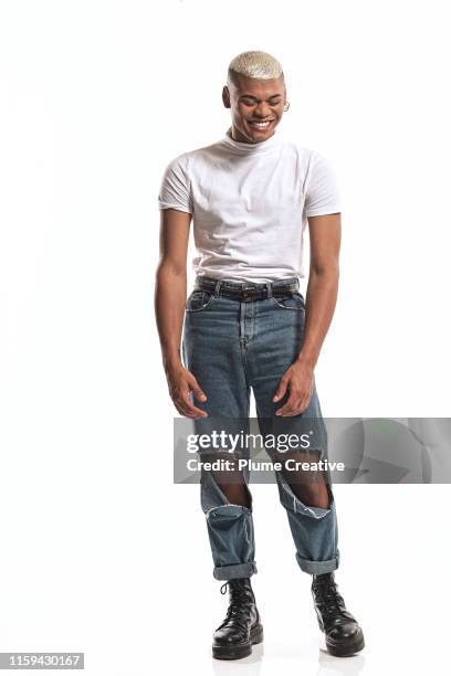 portrait of fashionable man in studio - neue männlichkeit stock-fotos und bilder