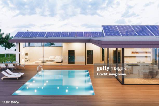 luxury villa with solar panels - houses in the sun stock pictures, royalty-free photos & images