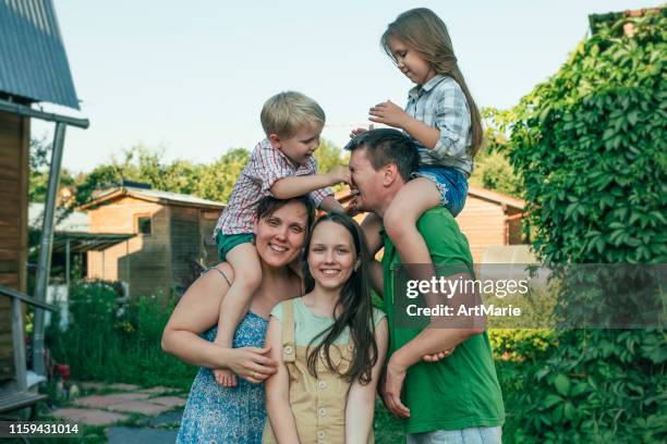 happy family having fun outdoors in summer - russian ethnicity stock pictures, royalty-free photos & images