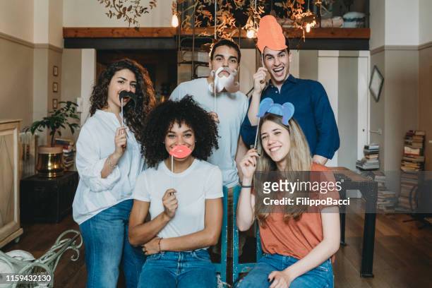 portrait of a group of friends with funny masks - italian carnival stock pictures, royalty-free photos & images