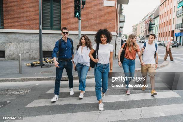 group of friends walking together in the city - five people stock pictures, royalty-free photos & images
