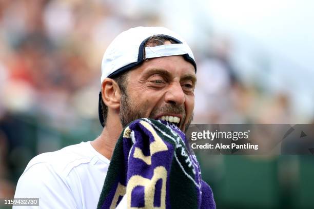 Paolo Lorenzi of Italy reacts in his Men's Singles first round match against Daniil Medvedev of Russia during Day one of The Championships -...
