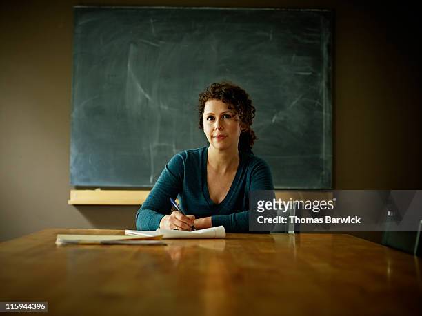 Portrait of businesswoman at conference room table