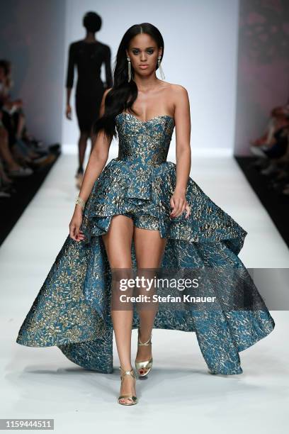 Model walks the runway at the Guido Maria Kretschmer show during the Berlin Fashion Week Spring/Summer 2020 at ewerk on July 01, 2019 in Berlin,...