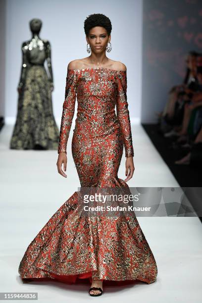 Model walks the runway at the Guido Maria Kretschmer show during the Berlin Fashion Week Spring/Summer 2020 at ewerk on July 01, 2019 in Berlin,...