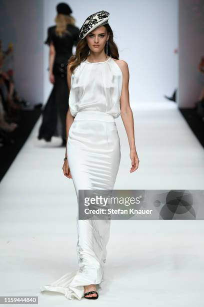 Model walks the runway at the Guido Maria Kretschmer show during the Berlin Fashion Week Spring/Summer 2020 at ewerk on July 01, 2019 in Berlin,...