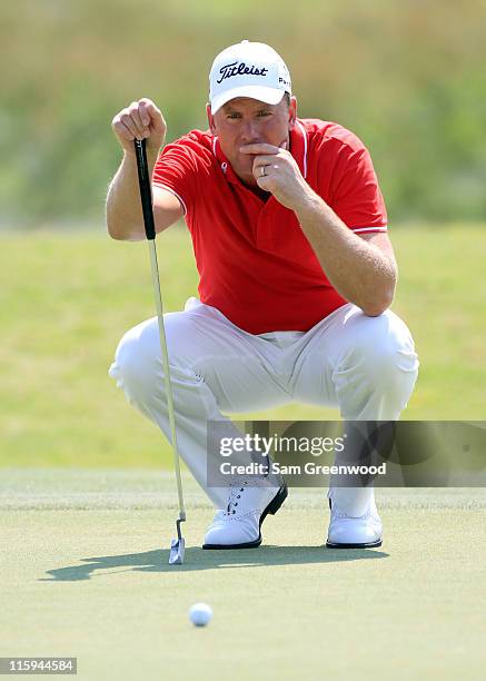 Robert Karlsson of Sweden looks over a shot on the 13th hole during the final round of the FedEx St. Jude Classic at TPC Southwind on June 12, 2011...