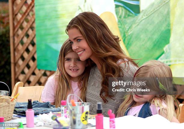 Actress Denise Richards with daughters Sam Sheen and Lola Rose Sheen decorate jeans at the 77kids American Eagle Denim Decorating Station during the...