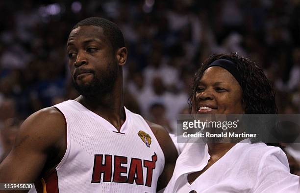 Dwyane Wade of the Miami Heat greets his mother Jolinda Wade prior to playing against the Dallas Mavericks in Game Six of the 2011 NBA Finals at...