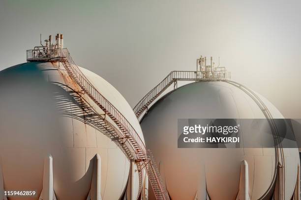sphere gas tanks in refiney plant - crude oil stock pictures, royalty-free photos & images