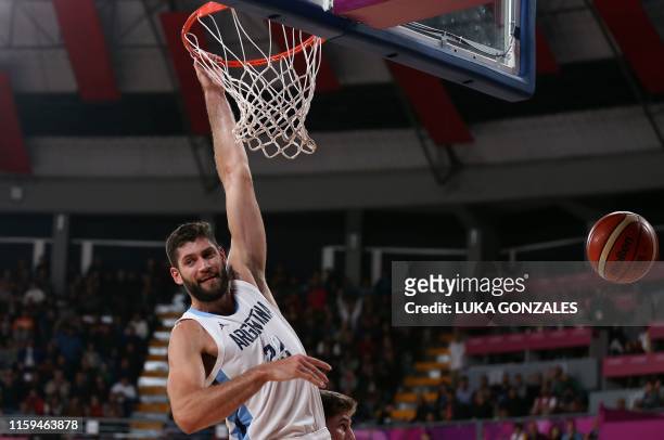 Argentina's Patricio Garino jumps to score against US in the Men's Basketball Semifinal game, during the Lima 2019 Pan-American Games in Lima on...
