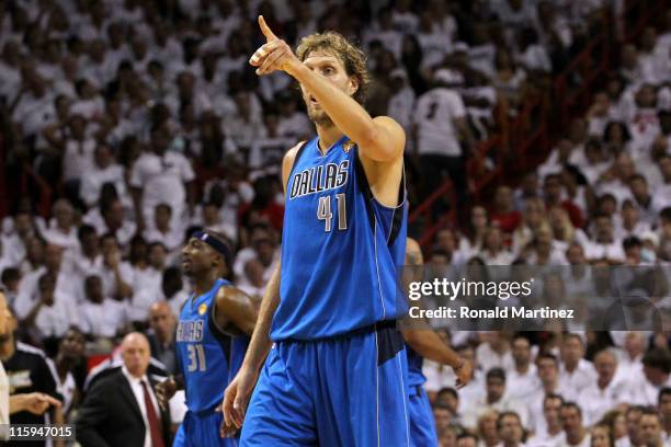 Dirk Nowitzki of the Dallas Mavericks gestures on court against the Miami Heat in the first half of Game Six of the 2011 NBA Finals at American...