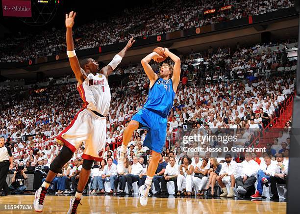 Dirk Nowitzki of the Dallas Mavericks shoots over Chris Bosh of the Miami Heat during Game Six of the 2011 NBA Finals on June 12, 2011 at the...