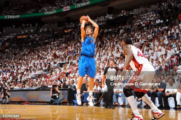 Dirk Nowitzki of the Dallas Mavericks shoots against Udonis Haslem of the Miami Heat during Game Six of the 2011 NBA Finals on June 12, 2011 at the...