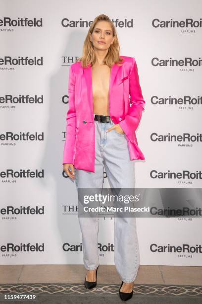 Elena Perminova attends the Carine Roitfeld Parfums "7 lovers" : Cocktail At The Peninsula Hotel In Paris on July 01, 2019 in Paris, France.